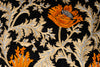 detail of an Exclusive orange tulips on black velvet fabric with intricate resham work & grey beads