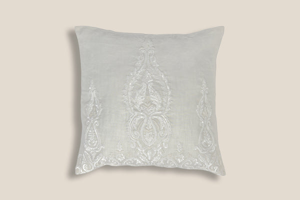 front of an Exclusive soft neutral cushion with white sequins design