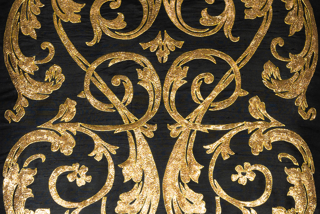 back of an exclusive black hand woven silk with pitta work in golden metal