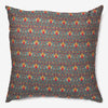 front of a Phooldani - green silk luxury cushion with orange flower thread work