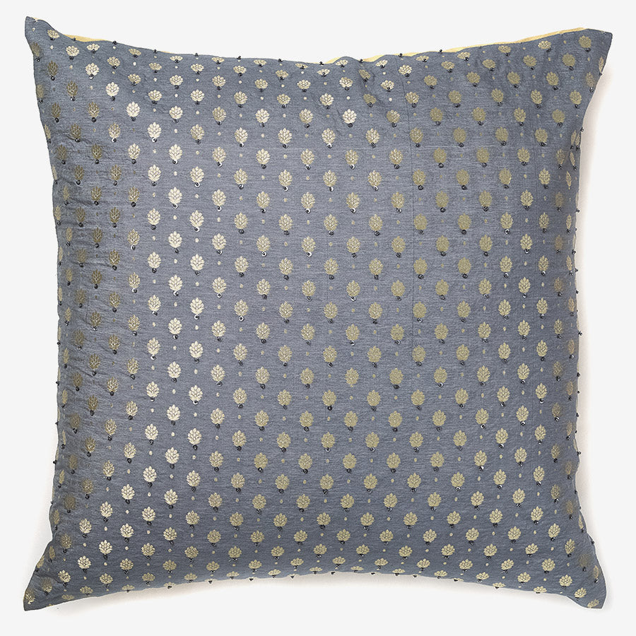 front of a Gold & grey silk luxury cushion cover with brocade motifs and sequins