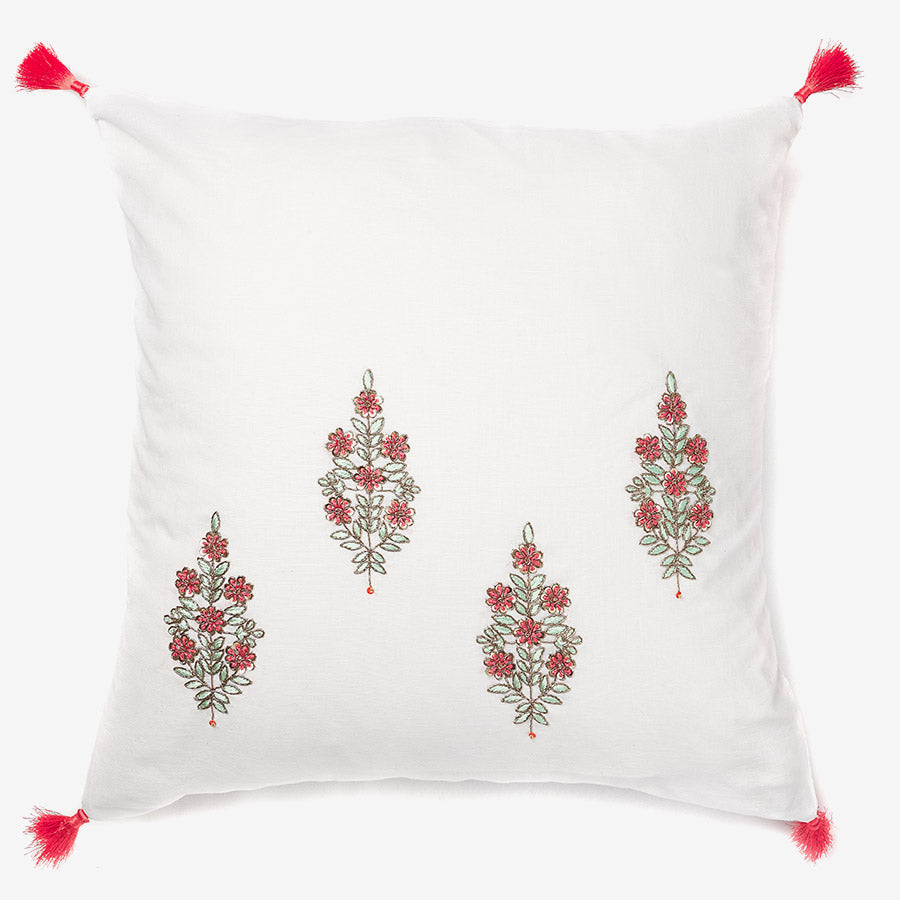 front of a White linen luxury cushion with zardozi work and tassels