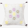 front of a white luxury cushion cover with multicolour leaves