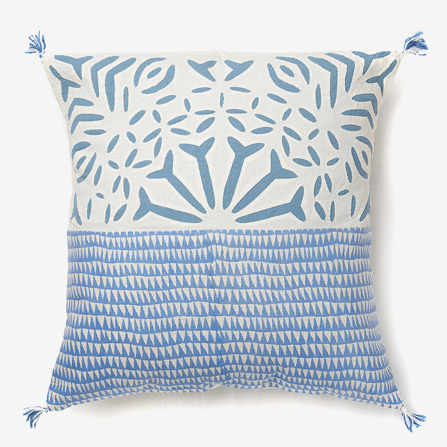 front of a Summer blue - white & blue luxury cushion with tassels