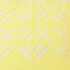 detail of a yellow luxury cushion cover